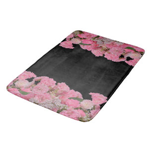 Blommiga rosa vita blommor svart bakgrund badrumsmatta