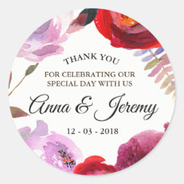 Blommigt av djup rosa, rött och lila runt klistermärke