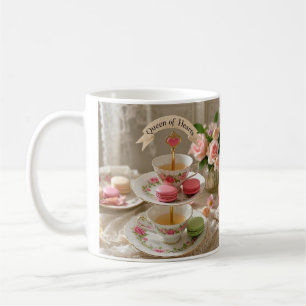 Blommigt bord, tekopp, skiktade brickor macarons Q Kaffemugg