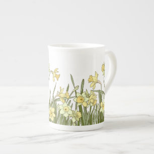 Blommigt gräns i gult-skyddsmedel på benporslin mugg