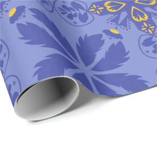 blommigt och geometriskt mönster i guld och blått presentpapper
