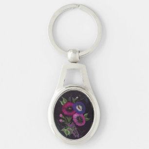 Blommigt på svart keychain ovalt silverfärgad nyckelring