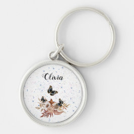 blommigt rund silverfärgad nyckelring