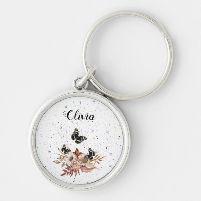 blommigt rund silverfärgad nyckelring (Framsidan)