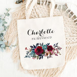 Blommigten Burgundy Bridesmaid Bröllop Gift Tygkasse<br><div class="desc">Ge ut söt tote bags till dina brudtärnor och maid of honor. Gör underbara gåvor/tack till presenter. Vattenfärgsbukett i  rosa,  burgundi,  marsala,  merlot,  vin,  blue och grönt. Lätt att redigera,  lägg till namn - brev i svart kan ändras till valfritt färg.</div>