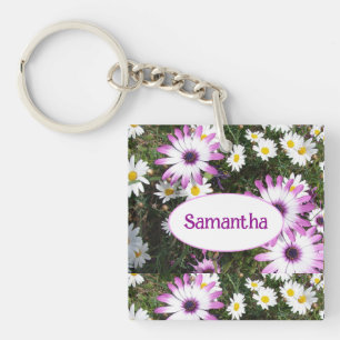 Blommigten för lila och vit Daisy i Namn