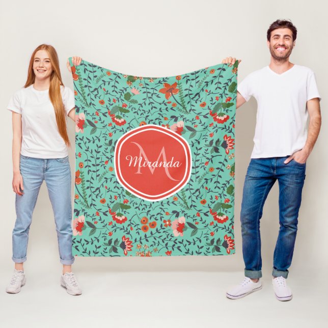 Blommönster i turkos och orange och rött monogram fleecefilt (På plats)