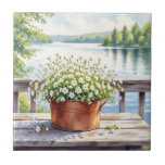 Blommor i kopparkruka på Lakehouse Deck Kakelplatta<br><div class="desc">Söt bricka med en vacker illustration av vita blommor i en kopparkruka med baksidan av en serene sjö med gräs träd.</div>