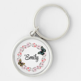 blommor och elegantens bakgrund rund silverfärgad nyckelring