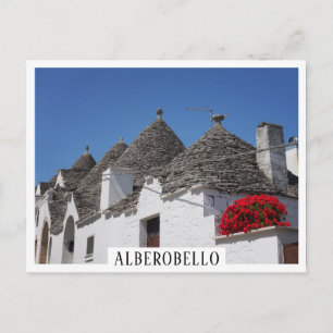 Blommor och trullhus i Geranium i Alberobello Vykort