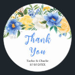 Blue and Yellow Floral Wedding Thank You Runt Klistermärke<br><div class="desc">This beautiful and elegant wedding thank you sticker features watercolor blue,  yellow and white flowers with foliage. The text combines handwritten script and serif fonts for a stylish and modern look. This is perfect for a spring or summer rustic wedding.</div>