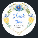 Blue and Yellow Floral Wedding Thank You Runt Klistermärke<br><div class="desc">This beautiful and elegant wedding thank you sticker features watercolor blue,  yellow and white flowers with foliage on a gold geometric frame. The text combines handwritten script and serif fonts for a stylish and modern look. This is perfect for a spring or summer rustic wedding.</div>