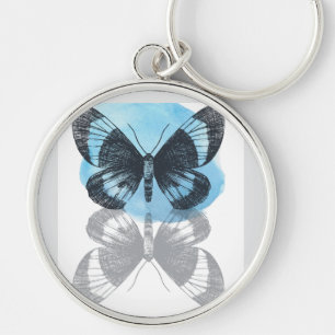 Blue Butterfly Magi. Rund Silverfärgad Nyckelring