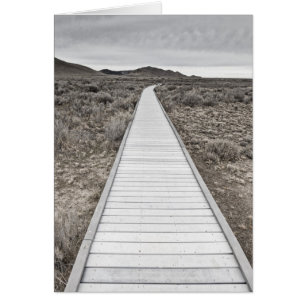 Boardpromenad genom öknen hälsningskort