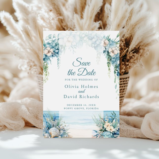 Boho Blue Blommigt Arch-fack Spara datumkortet Spara Datumet (Boho Blue Floral Arch Beach Save the Date Card in front of white pampas grass.)