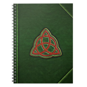 Boken av skuggar täcker anteckningsboken anteckningsbok med spiral