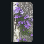 Bomullsblommor som växer på en mur plånboksfodral för samsung galaxy s5<br><div class="desc">Bomblommor som växer från en spricka i en vägg. Blåa blommor mot en mur. Blommor,  plånboksfodral.</div>
