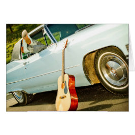 Boot i bilfönster och Westernt kort för gitarr