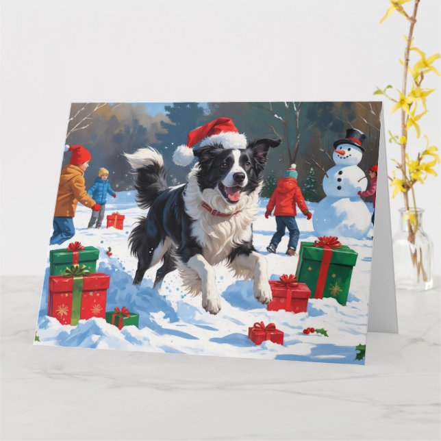Border Collie i tomtehatt som leker i snön Kort (Gul blomma)