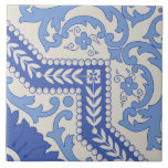 Botanical Beaded Frame Kakelplatta<br><div class="desc">Botanical Beaded Frame showcases a vibrant interplay of florals and foliage, framed with a distinctive dotted bead-like border. The sharp angles and rich botanical detailing create a dynamic layout, suggesting directionality and movement while maintaining an elegant cohesion. The blue and ivory palette evokes traditional ceramic art with a playful contemporary...</div>