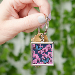 Botanisk orkidé trädgård med fjärilar fyrkantig silverfärgad nyckelring