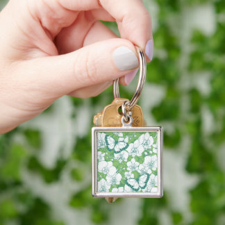 Botanisk orkidé trädgård med fjärilar i grönt fyrkantig silverfärgad nyckelring