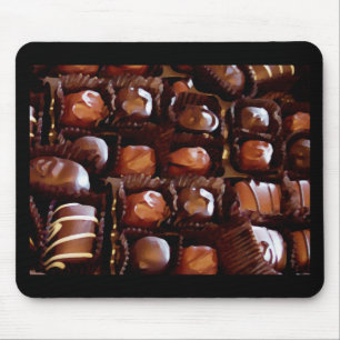 Boxas av choklader, frestande chokladgodis musmatta