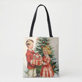 Boy and girl giving each other Christmas presents Tygkasse