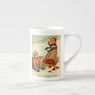 Boy and Girl spelar i snö Vintage-julen Benporslin Mugg