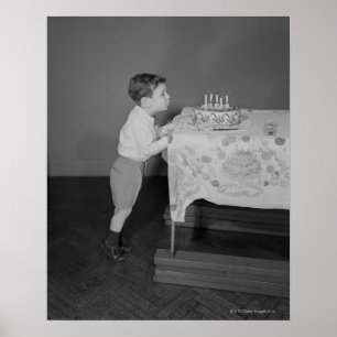 Boy Blowing Candles Poster
