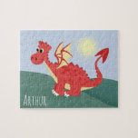 Boys Cute och Magic Red Welsh Dragon och Namn Pussel<br><div class="desc">Den här söta och moderna barnpusslet har en härlig röd walesisk drake-tecknad,  blå himmel och backe och kan vara personlig med dina pojkar namn. Den perfekt roligten Wales-temat gåva till alla barn.</div>
