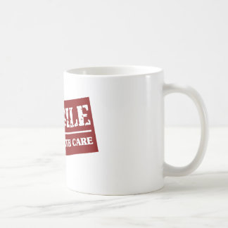 Bräckligt handtag med omsorgobjektet kaffemugg
