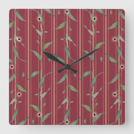 Branch of leaves on red wallpaper fyrkantig klocka