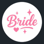 Bride Neon Pink Script Runt Klistermärke<br><div class="desc">Celebrate your special day with this vibrant "Bride" design in bold neon pink script, accented with playful stars and a heart. Perfect for bachelorette parties, bridal showers, hen dos, and wedding celebrations! Add a fun, festive touch to t-shirts, tote bags, mugs, and more. Make the bride-to-be feel extra special with...</div>