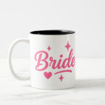 Bride Neon Pink Två-Tonad Mugg<br><div class="desc">Celebrate your special day with this vibrant "Bride" design in bold neon pink script, accented with playful stars and a heart. Perfect for bachelorette parties, bridal showers, hen dos, and wedding celebrations! Add a fun, festive touch to t-shirts, tote bags, mugs, and more. Make the bride-to-be feel extra special with...</div>