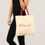 Bridesmaid Burgundy-teckensnitt Tygkasse<br><div class="desc">Den här designen är en vacker toteväska för ett vackert brud och har ett vackert,  kursivt,  burgundärt typsnitt.  Ställe din beställning i dag!</div>