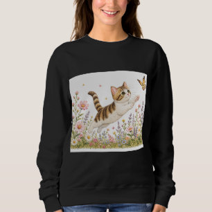Broderad kattunge jagar fjäril i vildblomma t shirt
