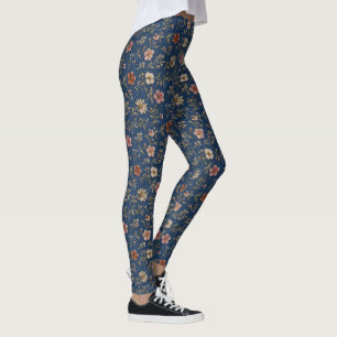 Broderade enfaldiga vildblommor på denim bakgrund leggings