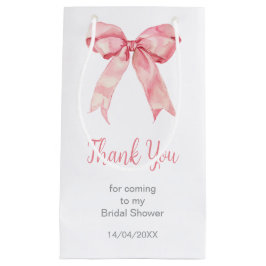 Bröllopsfest med rosa coquettebåge