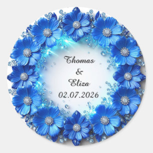 Bröllopskrans av gnistrande blå blommor runt klistermärke