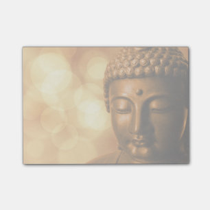 Bronze Buddha Statue med Golden Bokeh Background Post-it Block