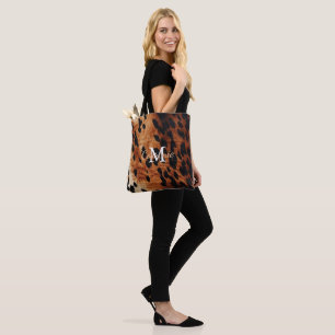 Brown Cowhide Monogram Tygkasse