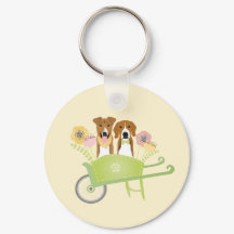 Brown Hundar i Wheelbarrow Vår blommor