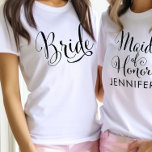 Brud kalligrafi framtida fru vita damer t shirt<br><div class="desc">Enkel och fantastisk, denna vita t-shirt har "Brud" i vacker svart kalligrafi på framsidan. Baksidan visar "Framtidig fru" i elegant skrivstil med ett anpassningsbart efternamn i feta versaler för en personlig monogramdetalj. En mångsidig bröllopps-t-shirt för möhippor, brud shower, smekmånad resor och vardaglig brud-till-att bära. Anpassa efternamnet för att göra anspråk...</div>