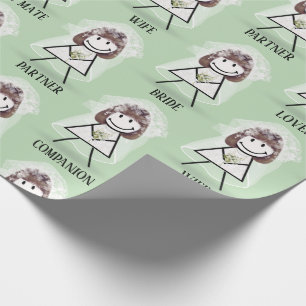 Brudpinneflicka med bröllopstext på grön presentpapper