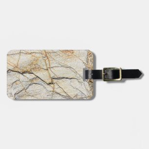 Brun och svart texturerad marmorerad sten bagagebricka