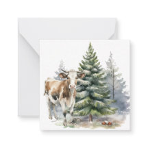 Brun- och vitkalv på framsidan av Gräs träd