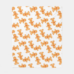 Brun pepparkaksgubbe på vitt fleecefilt