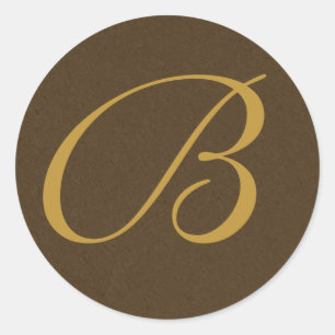 Bruna och guld monogrammed kuvertförseglingar runt klistermärke