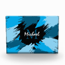 Brushstrokes skuggor av blå namn med monogram